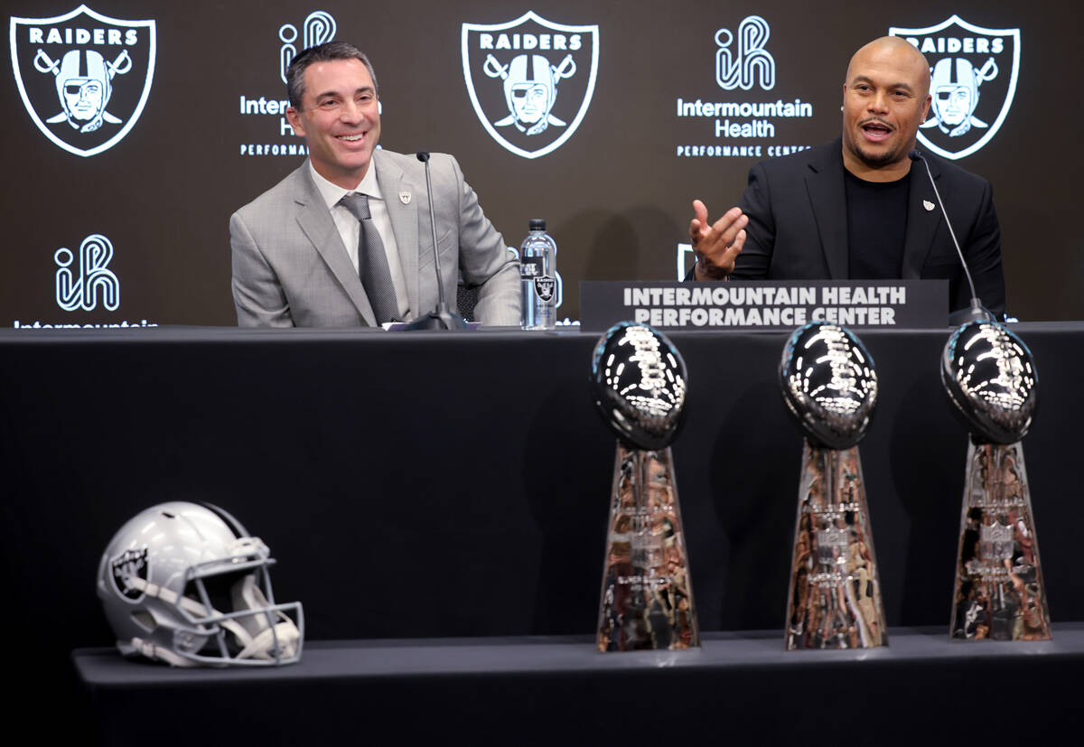 Tom Telesco, left, and Antonio Pierce are introduced as general manager and coach during a pres ...