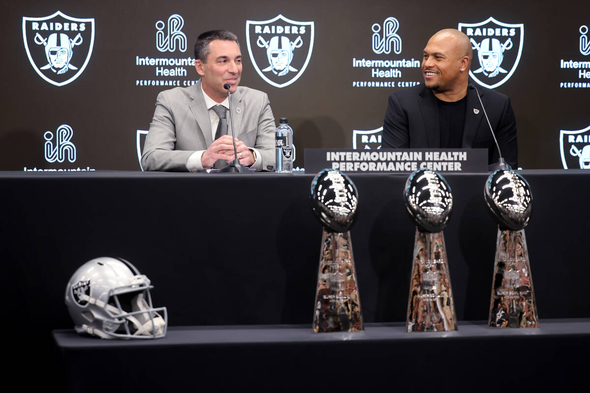 Tom Telesco, left, and Antonio Pierce are introduced as general manager and coach during a pres ...