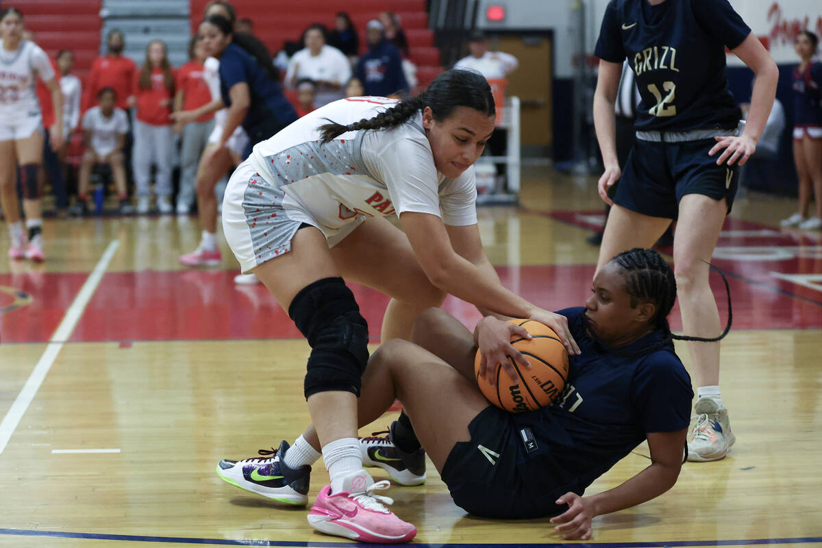 Liberty's Leiliani Harworth (33) battles for the ball with Spring Valley's Mi'yana Stephens (4) ...