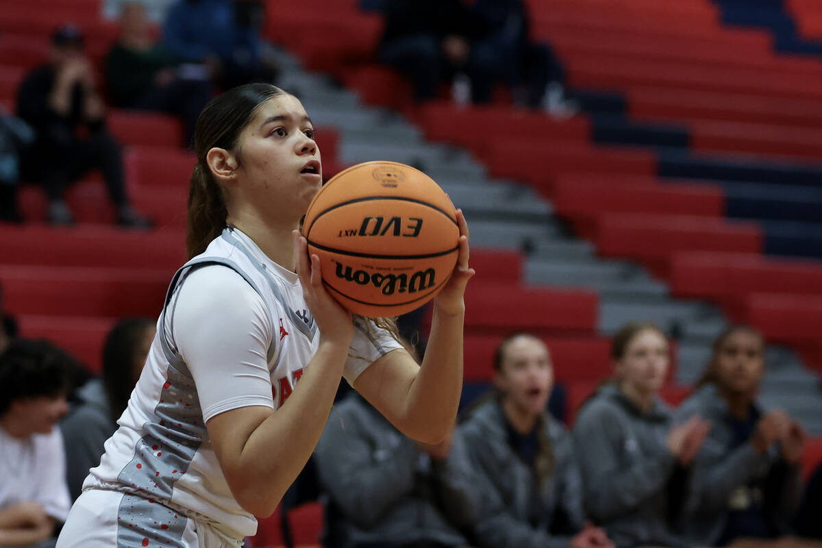 Liberty's Xasia Smith (23) shoots from the corner during the first half of a high school basket ...