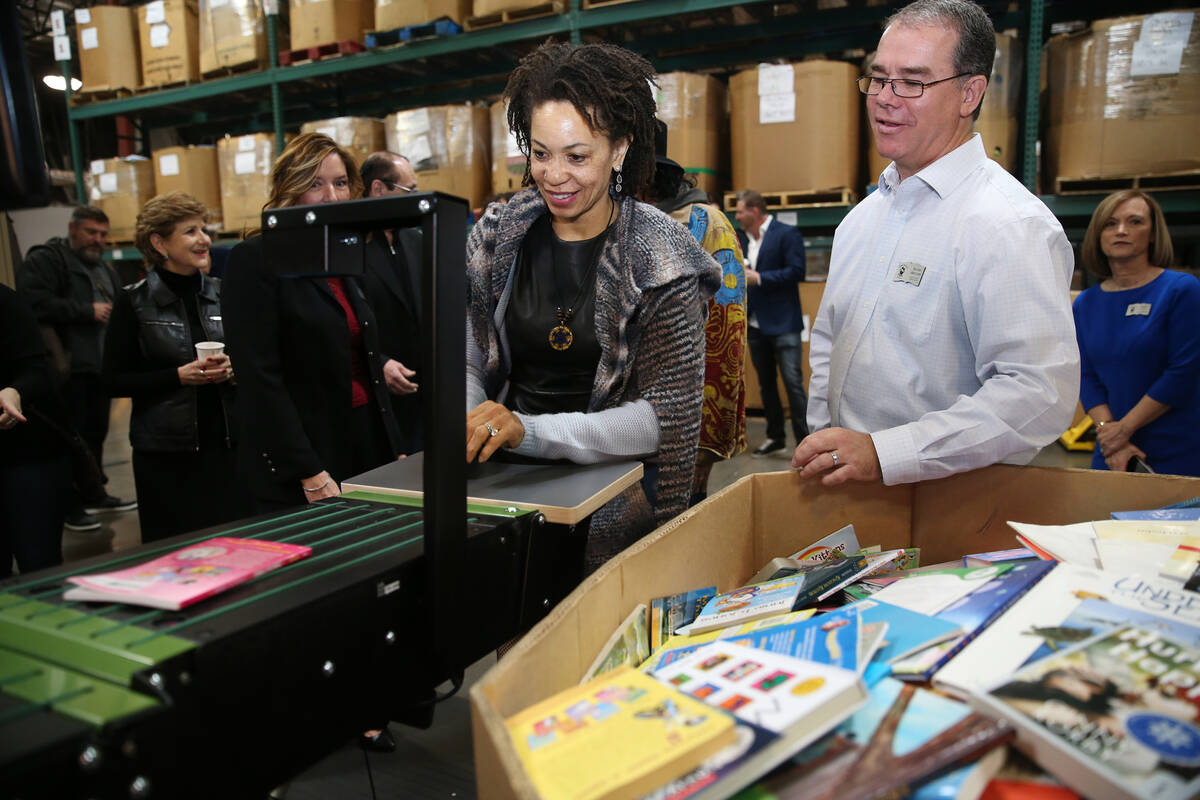 Cindy Blackman Santana, center, with David Ortlipp, right, director of operations at Spread the ...