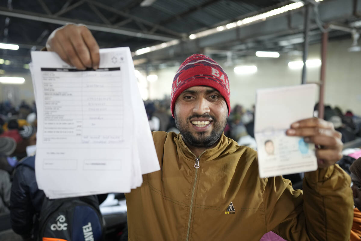 Anup Singh, an Indian skilled worker aspiring to be hired for a job in Israel shows his passpor ...