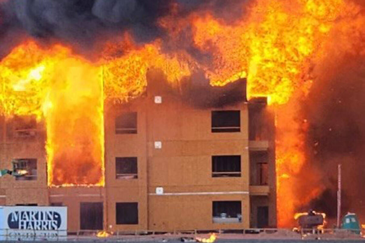 An under-construction apartment complex burns near Buffalo Drive and the 215 Beltway on Tuesday ...