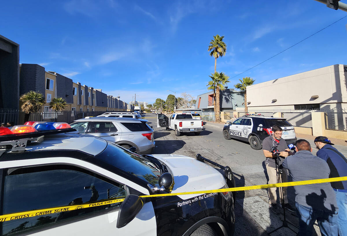 Police at the scene of a homicide on Friday, Jan. 25, 2024, on a sidewalk in the 3700 block of ...