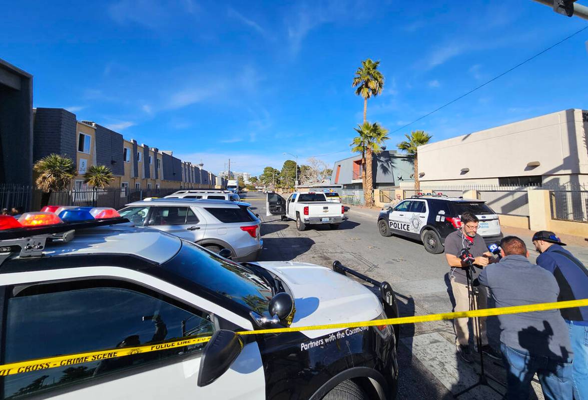 Police at the scene of a homicide on Friday, Jan. 25, 2024, on a sidewalk in the 3700 block of ...