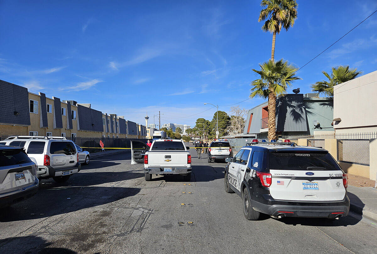 Police at the scene of a homicide on Friday, Jan. 25, 2024, on a sidewalk in the 3700 block of ...