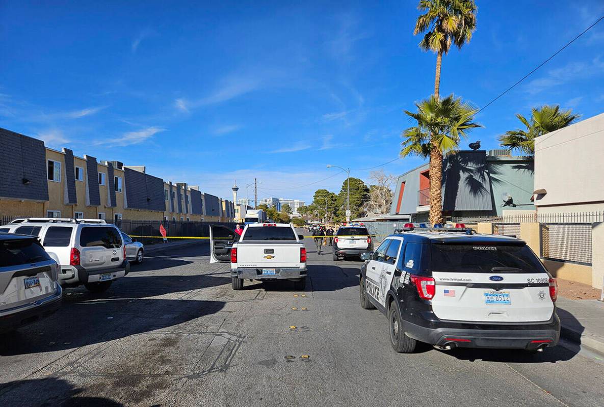 Police at the scene of a homicide on Friday, Jan. 25, 2024, on a sidewalk in the 3700 block of ...