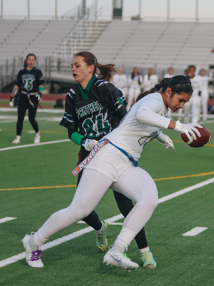 Palo Verde defensive back Taylor Bringhurst (84) grabs Bishop Gorman wide receiver Preseah Will ...