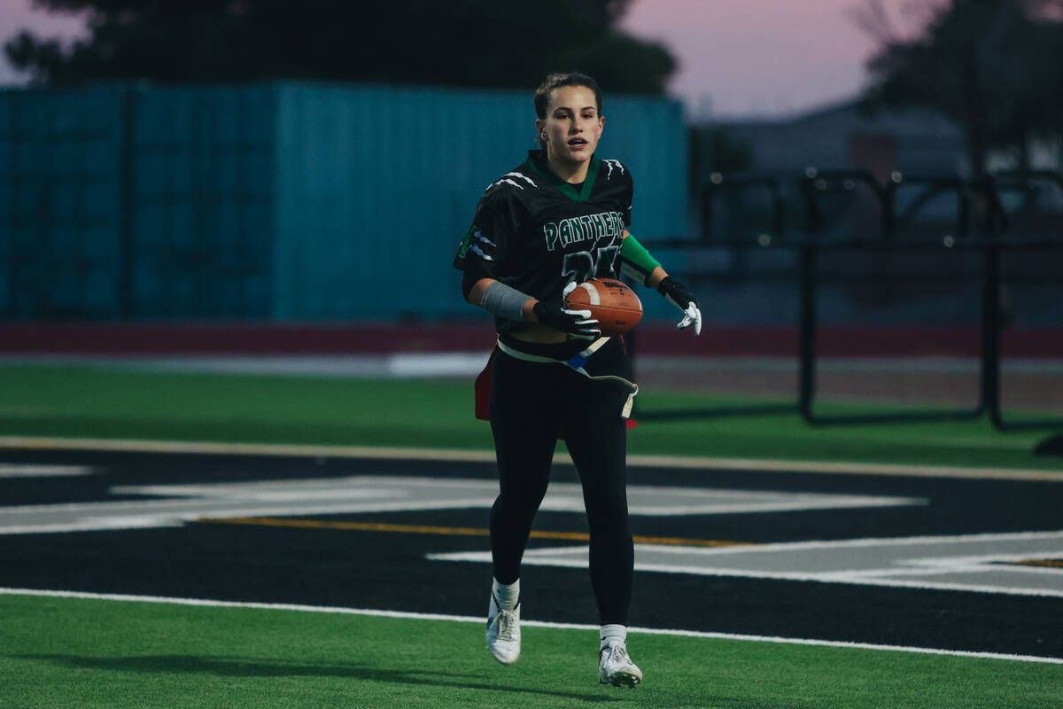 Palo Verde linebacker Olivia Perkins runs to a referee after a touchdown during a flag football ...