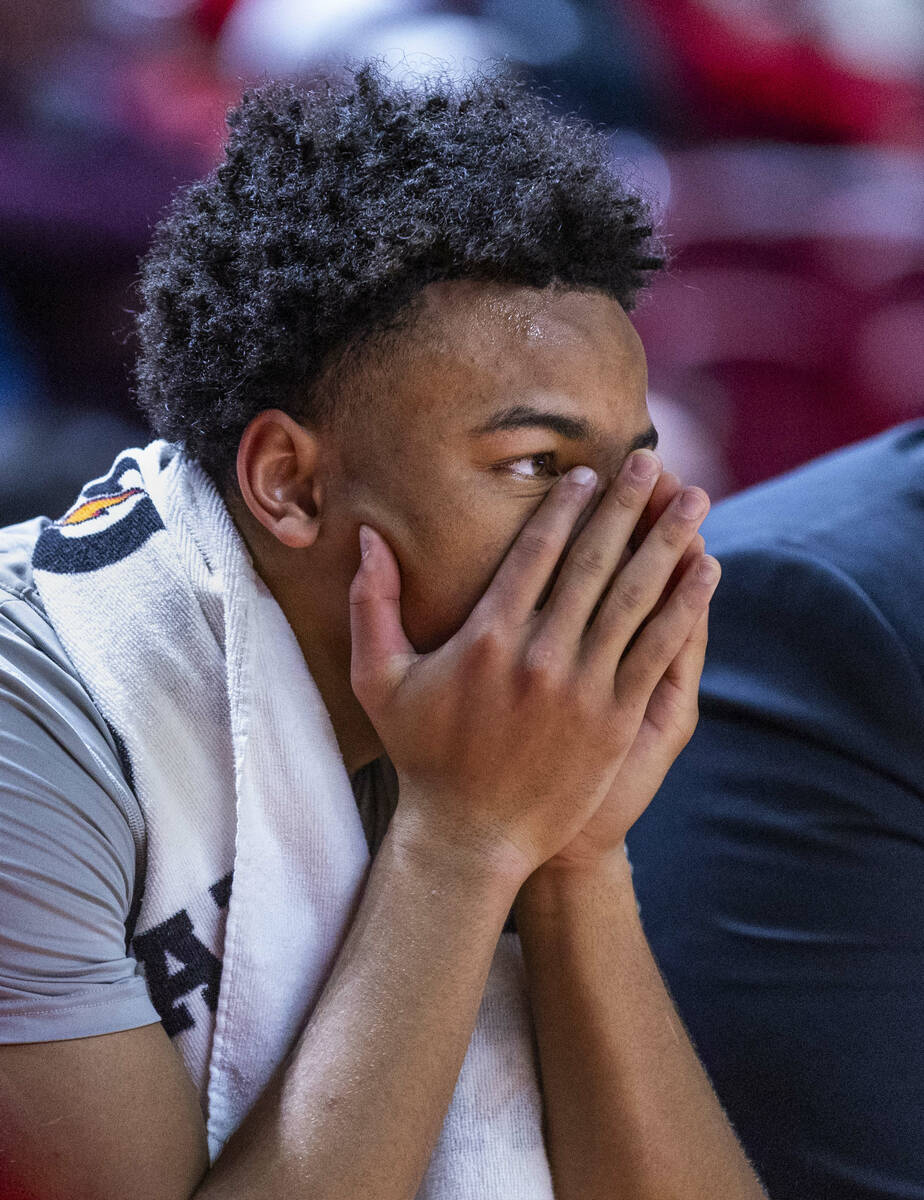 UNLV guard Dedan Thomas Jr. (11) is dejected on the bench as the Air Force Falcons lead by many ...
