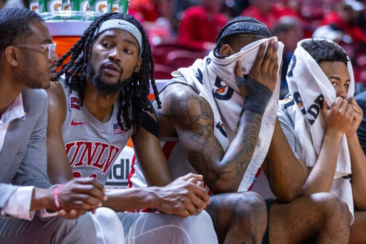 UNLV forward Keylan Boone (20), guard Luis Rodriguez (15) and guard Dedan Thomas Jr. (11) are d ...