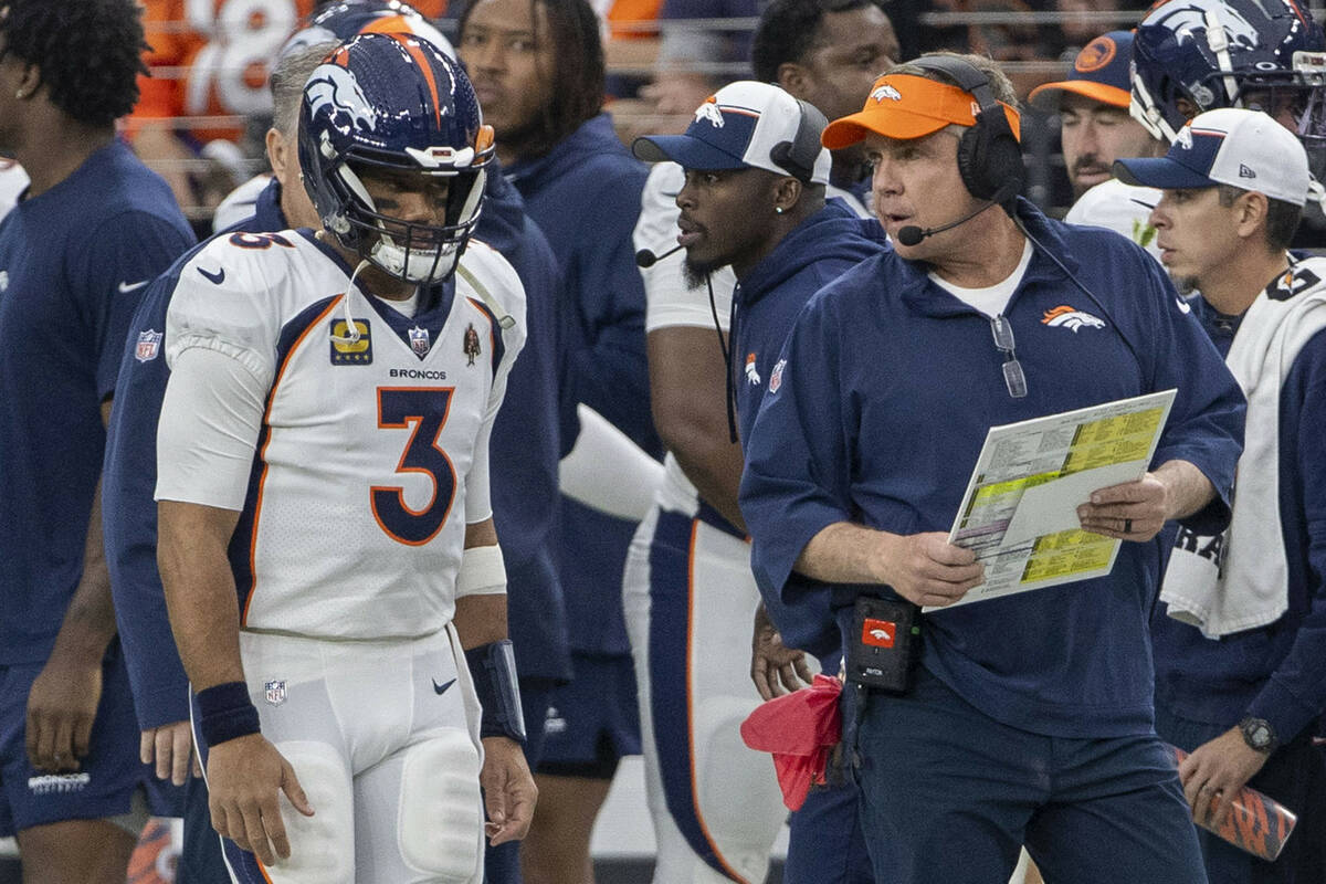 Denver Broncos quarterback Russell Wilson (3) stands behind head coach Sean Payton during the f ...