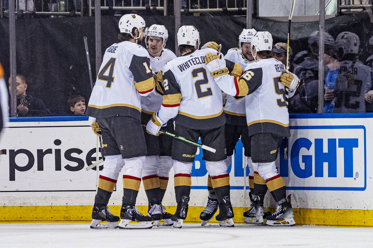 Vegas Golden Knights players celebrate a goal by right wing Sheldon Rempal against the New York ...