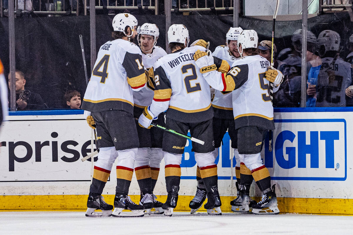 Vegas Golden Knights right wing Keegan Kolesar celebrates with teammates after scoring during t ...