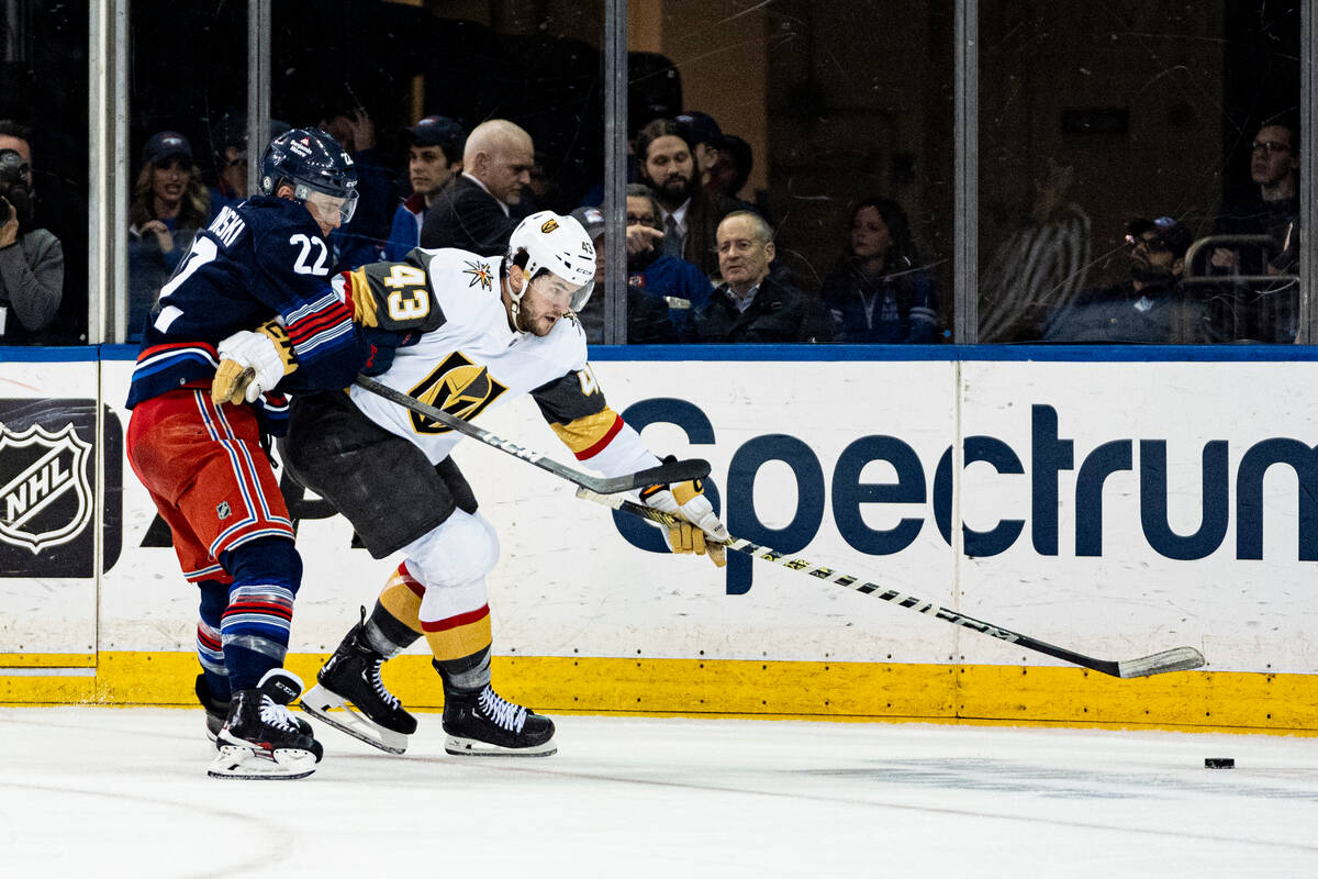 Vegas Golden Knights center Paul Cotter (43) and New York Rangers center Jonny Brodzinski (22) ...