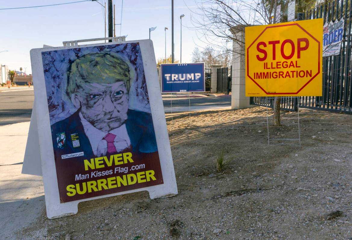 Signage out on the street as supporters line up outside to see Republican presidential candidat ...