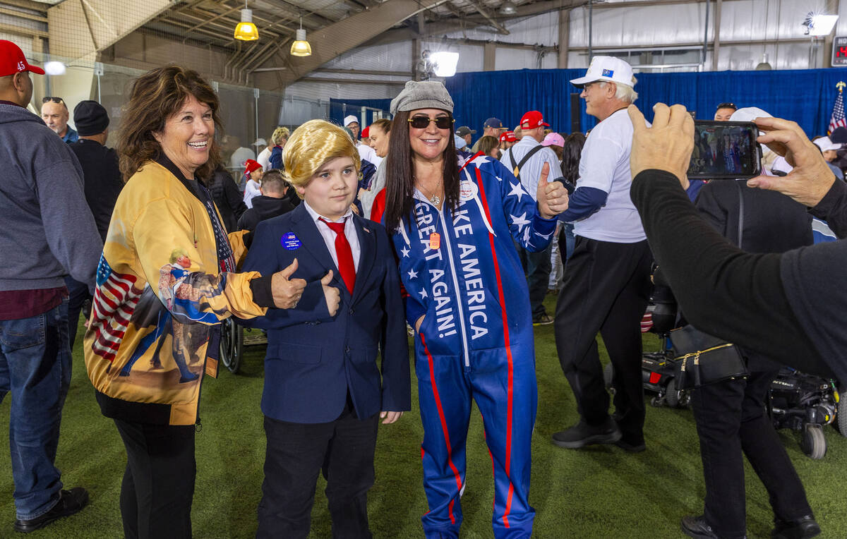Shayne Skougard, 11, of Las Vegas poses with other supporters while awaiting the arrival of Rep ...