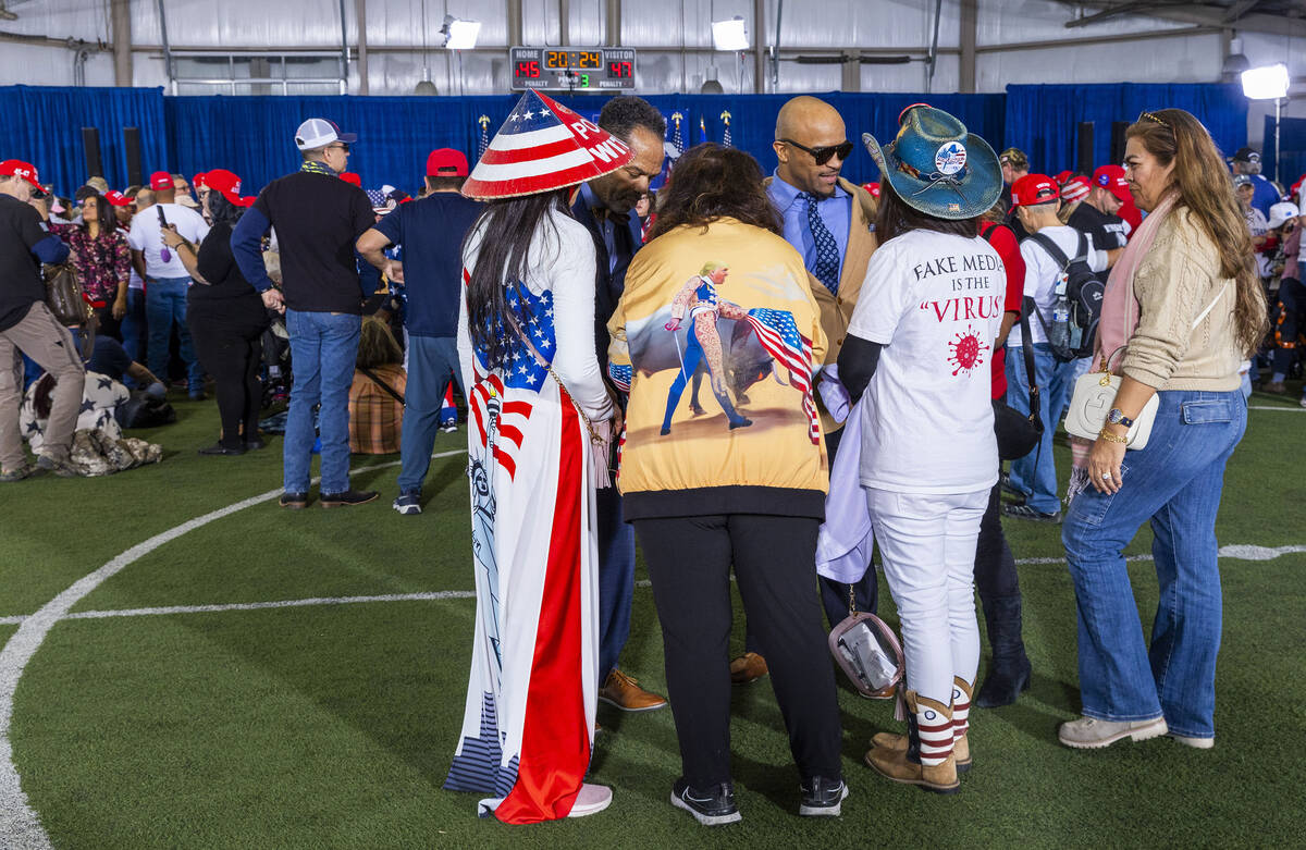 Supporters gather while awaiting the arrival of Republican presidential candidate former Presid ...