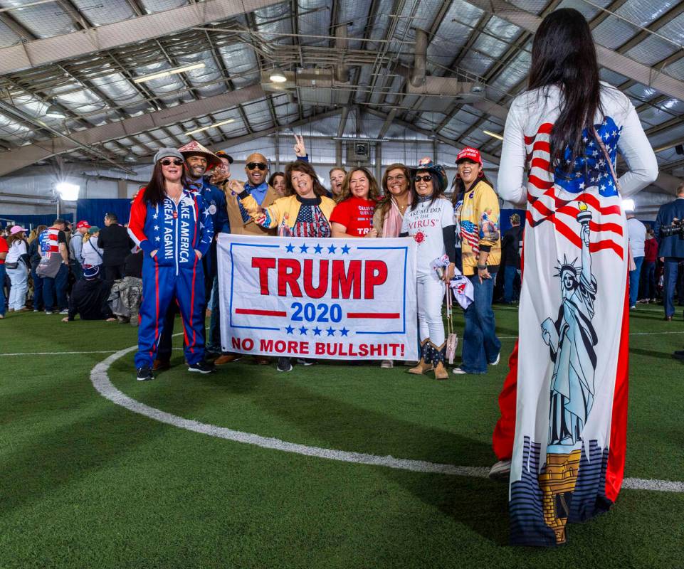 Supporters gather for a photo while awaiting the arrival of Republican presidential candidate f ...