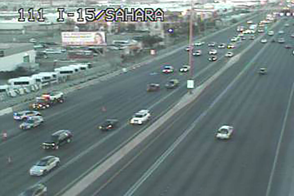 A tow truck and Nevada Highway Patrol vehicle near the Sahara Avenue off-ramp at Interstate 15 ...