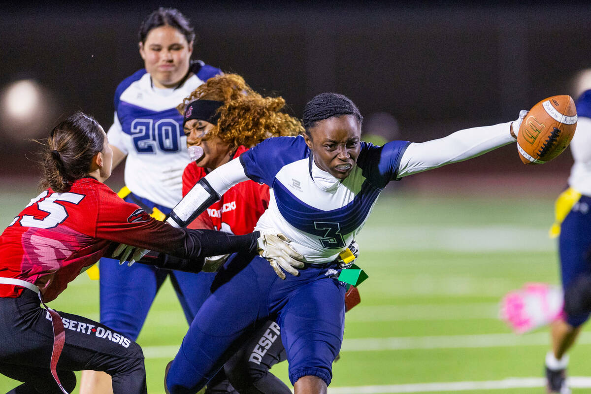 Shadow Ridge running back Kyla Moore (3) iso stopped by Desert Oasis defenders Brianna Renneker ...