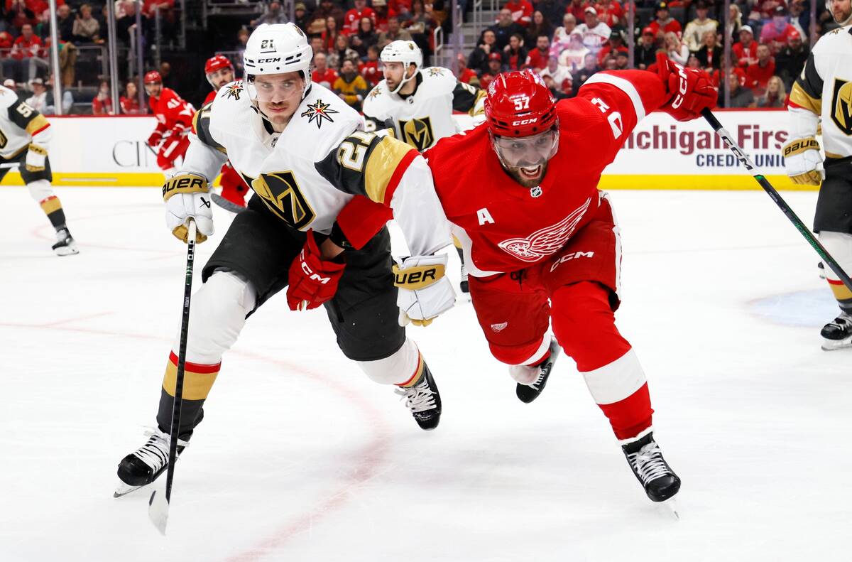 Vegas Golden Knights center Brett Howden (21) and Detroit Red Wings left wing David Perron (57) ...