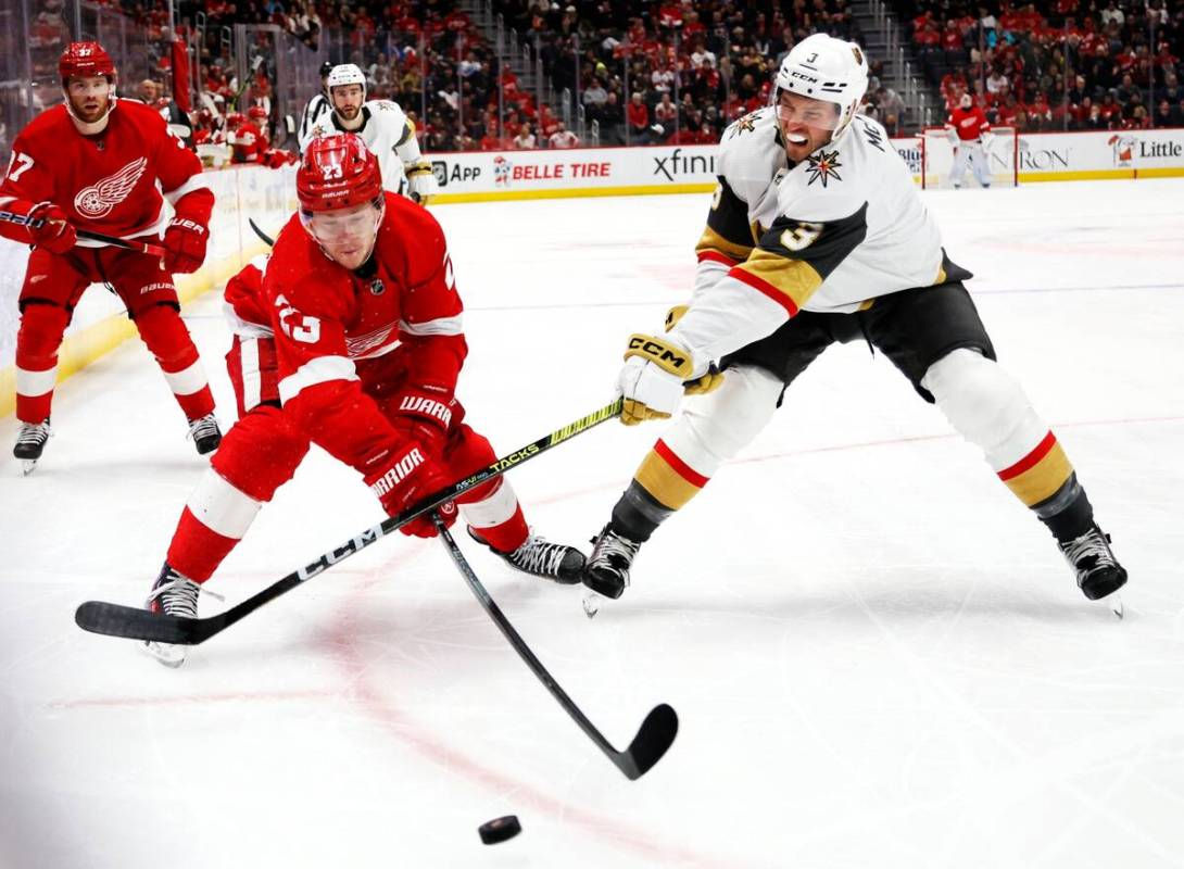 Vegas Golden Knights defenseman Brayden McNabb (3) hits the hand of Detroit Red Wings left wing ...