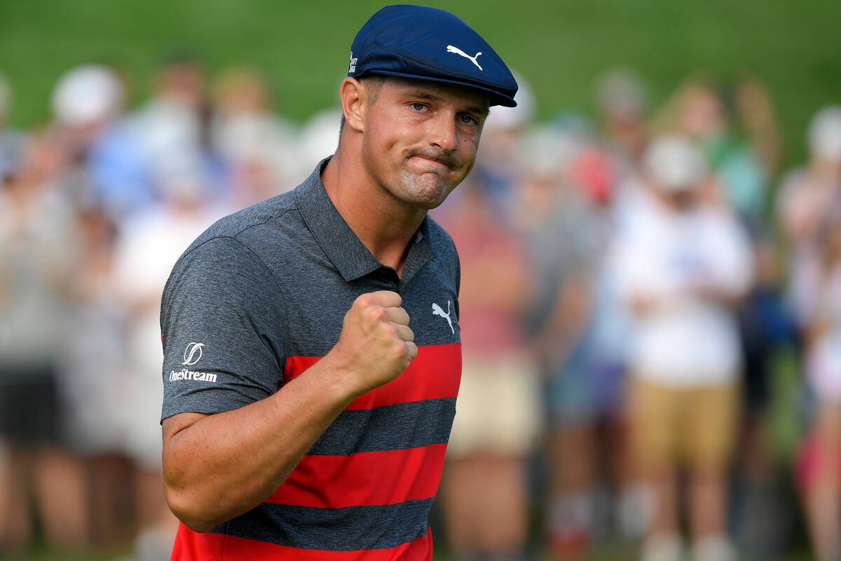 FILE- In this Aug. 29, 2021, file photo, Bryson DeChambeau reacts after sinking his putt on the ...