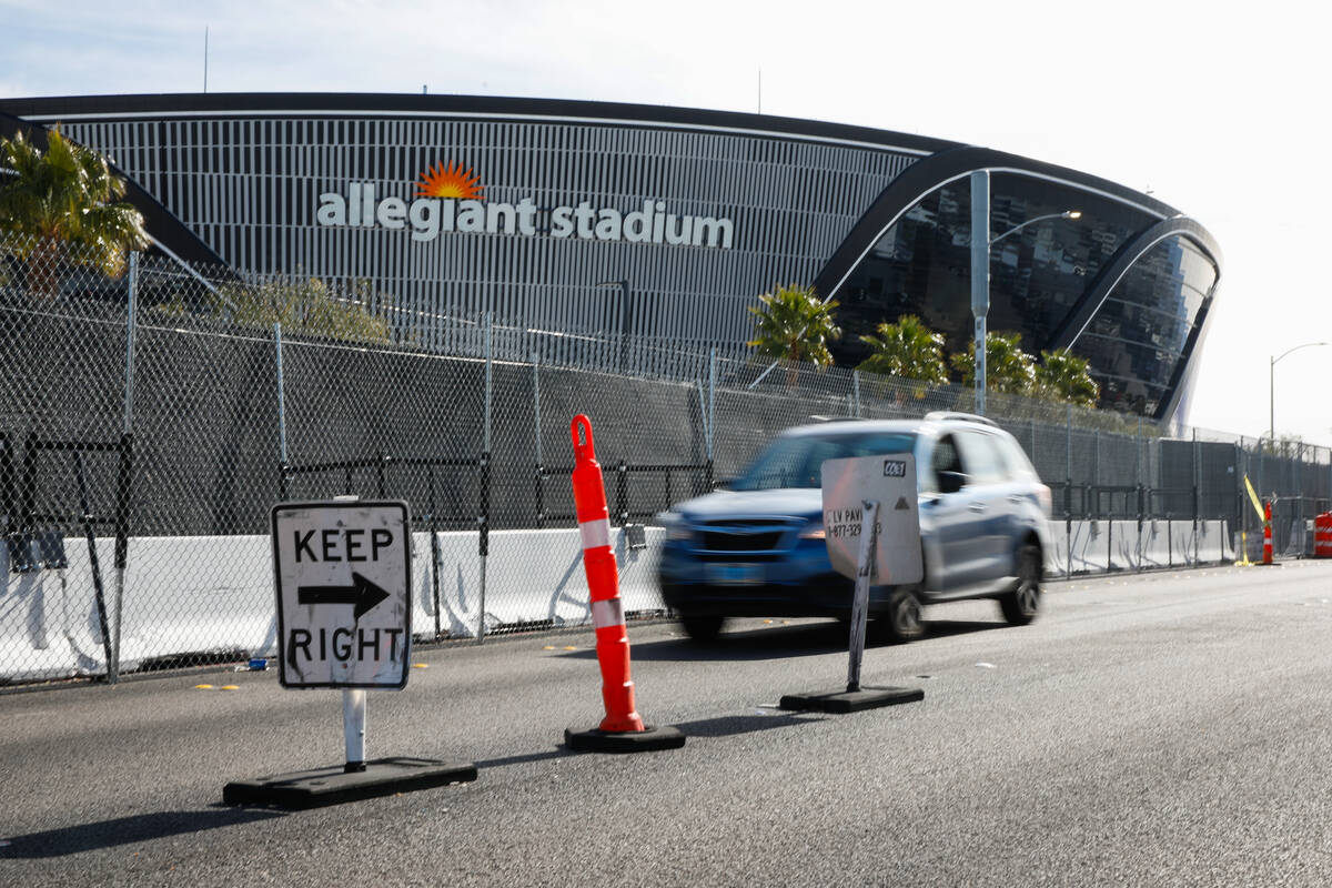 A large barrier separates northbound and southbound traffic along Polaris Avenue between Russel ...