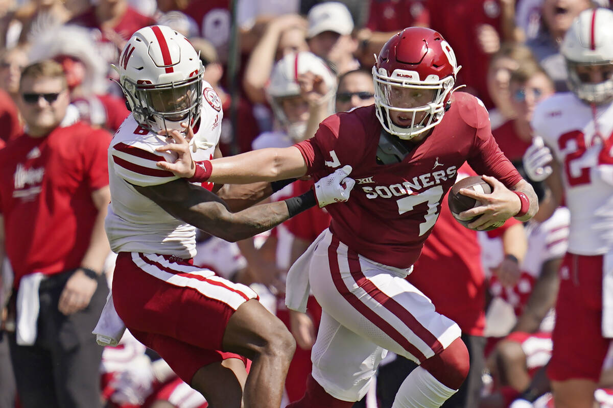 Oklahoma quarterback Spencer Rattler (7) grabs the face mask of Nebraska cornerback Quinton New ...