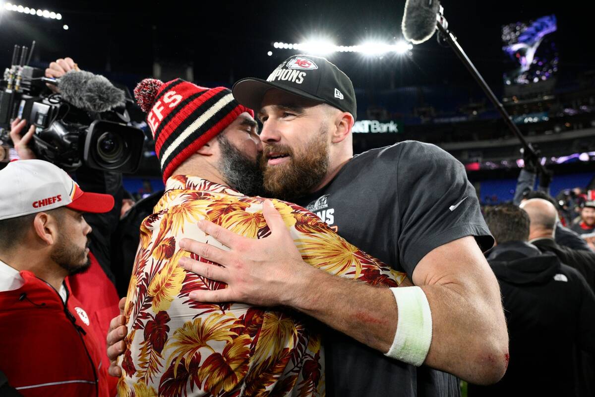 Jason Kelce embraces his brother Kansas City Chiefs tight end Travis Kelce after the AFC Champi ...