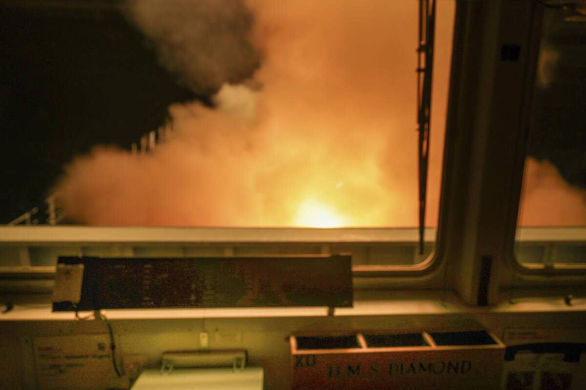 In this photo provided by the Royal Navy a view of HMS Diamond from the ships bridge, firing Se ...