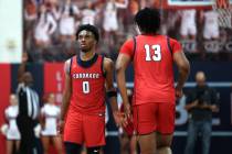 Coronado guard Jonny Collins (0) and Liberty guard Jaden Riley (13) slap hands during the secon ...