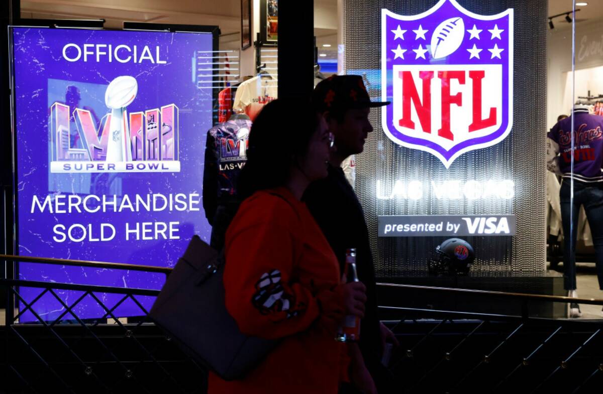 Shoppers walk past the NFL Las Vegas store at the Forum Shop, on Tuesday, Jan. 30, 2024, in Las ...
