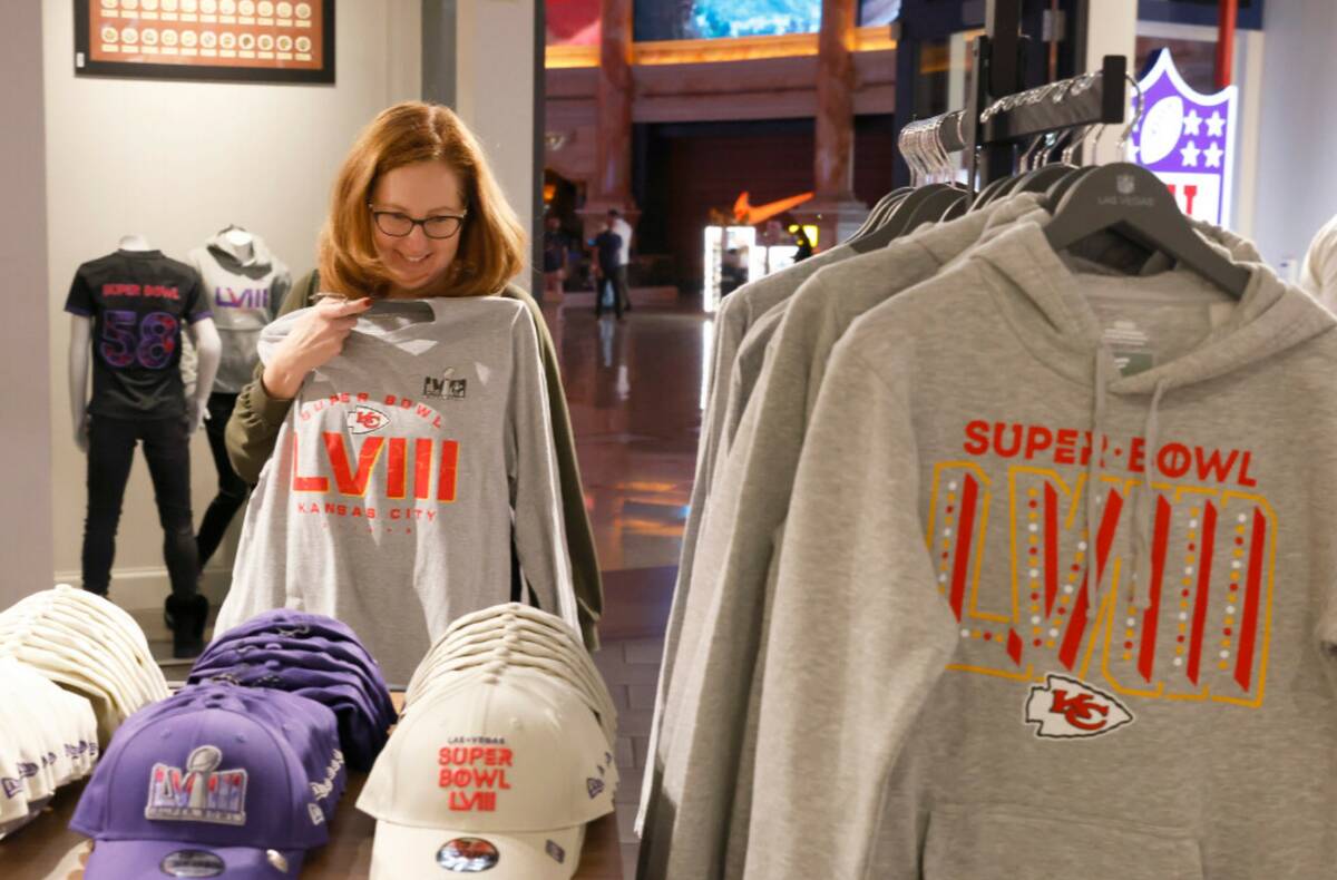 Jean Ziak of Chicago, a Kansas City Chiefs fan, checks out Super Bowl LVIII merchandise at the ...