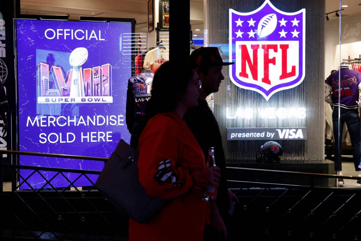 Shoppers walk past the NFL Las Vegas store at the Forum Shops, on Tuesday, Jan. 30, 2024, in La ...