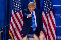 Republican presidential candidate former President Donald Trump points to the crowd while arriv ...