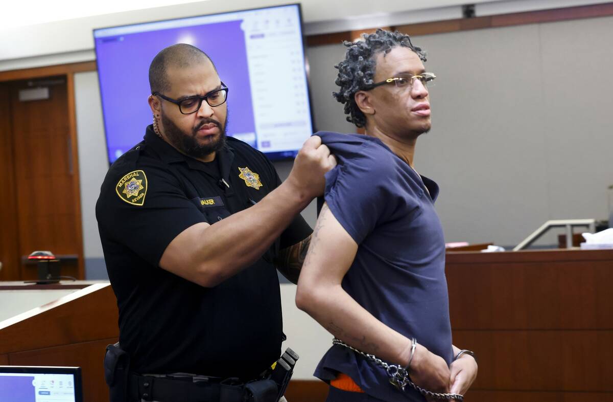 Omar Talley is led out of the courtroom during his sentencing at the Regional Justice Center, o ...