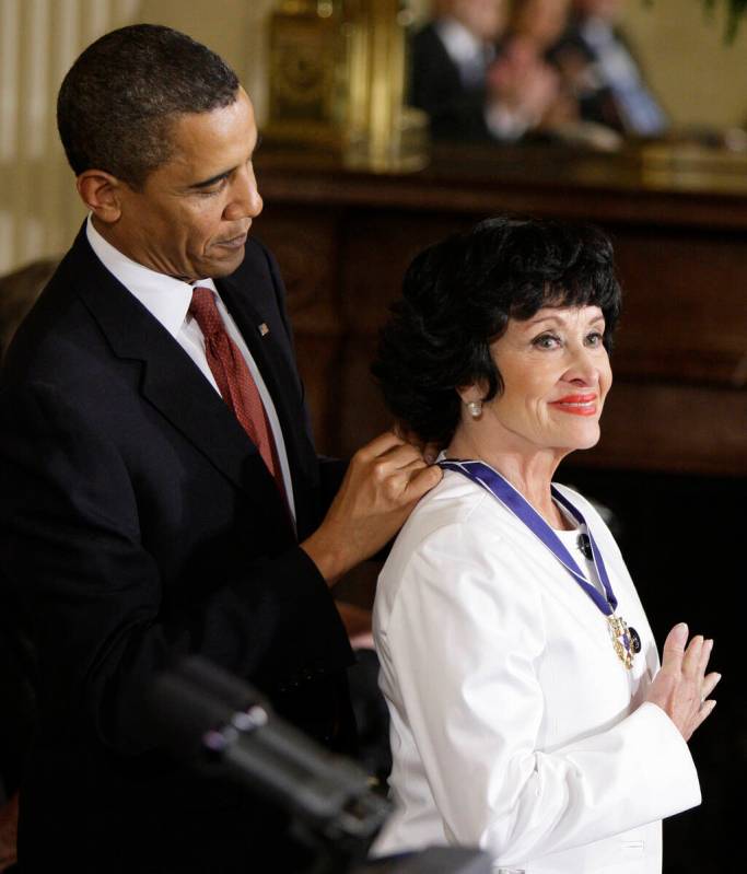 FILE - President Barack Obama places a 2009 Presidential Medal of Freedom around the neck of Ch ...