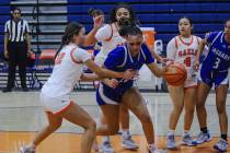 Desert Pines’ London Scott (10) tries to break past Bishop Gorman’s Addysen Carr ...