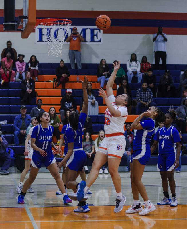 Bishop Gorman’s Savannah Searcy (32) goes for a basket against Desert Pines High School ...