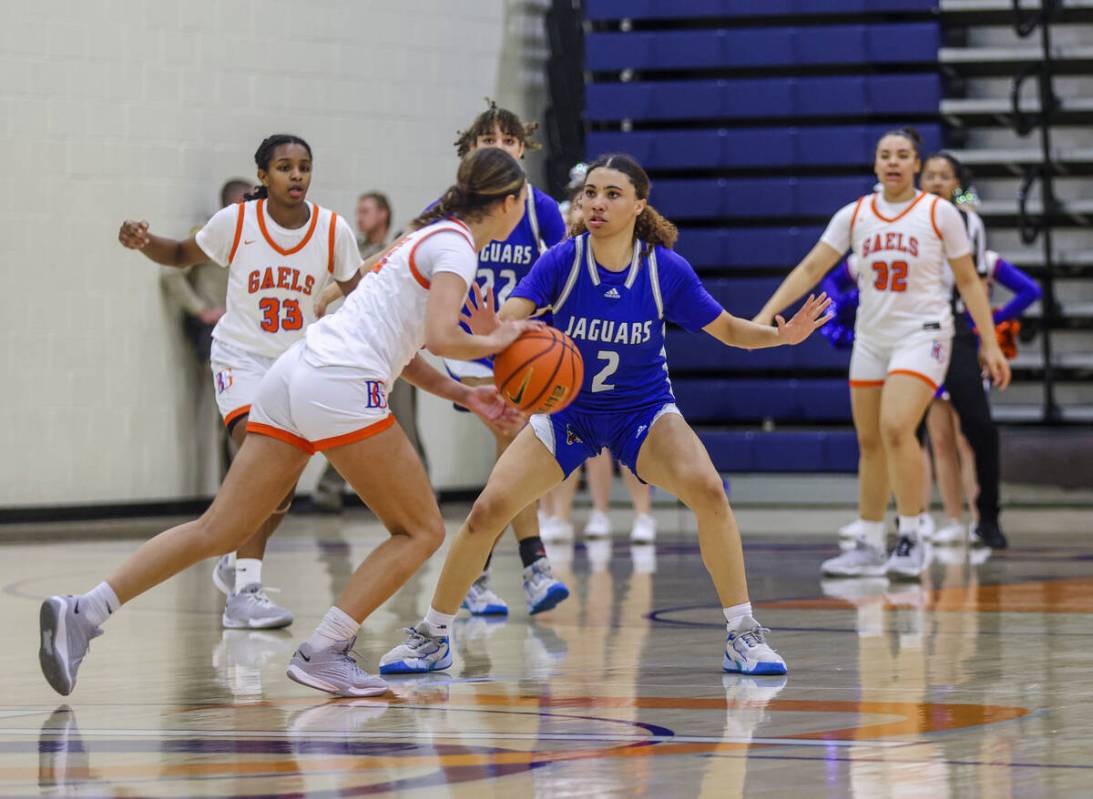 Desert Pines’ Mya Harper (2) tries to block Bishop Gorman’s Addysen Carr (12) dur ...