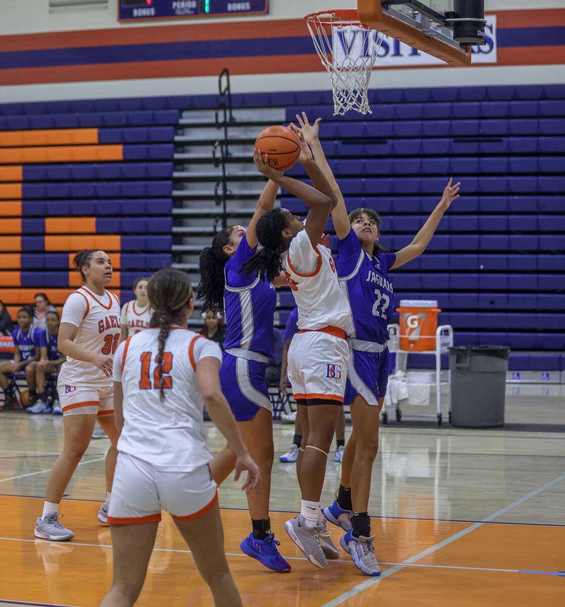 Bishop Gorman’s Neeyah Webster (33) attempts to make a rebound shot against Desert Pines ...