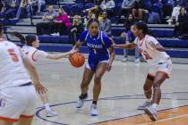 Desert Pines’ Siara Bracey (1) attempts to break past Bishop Gorman’s Neeyah Webs ...