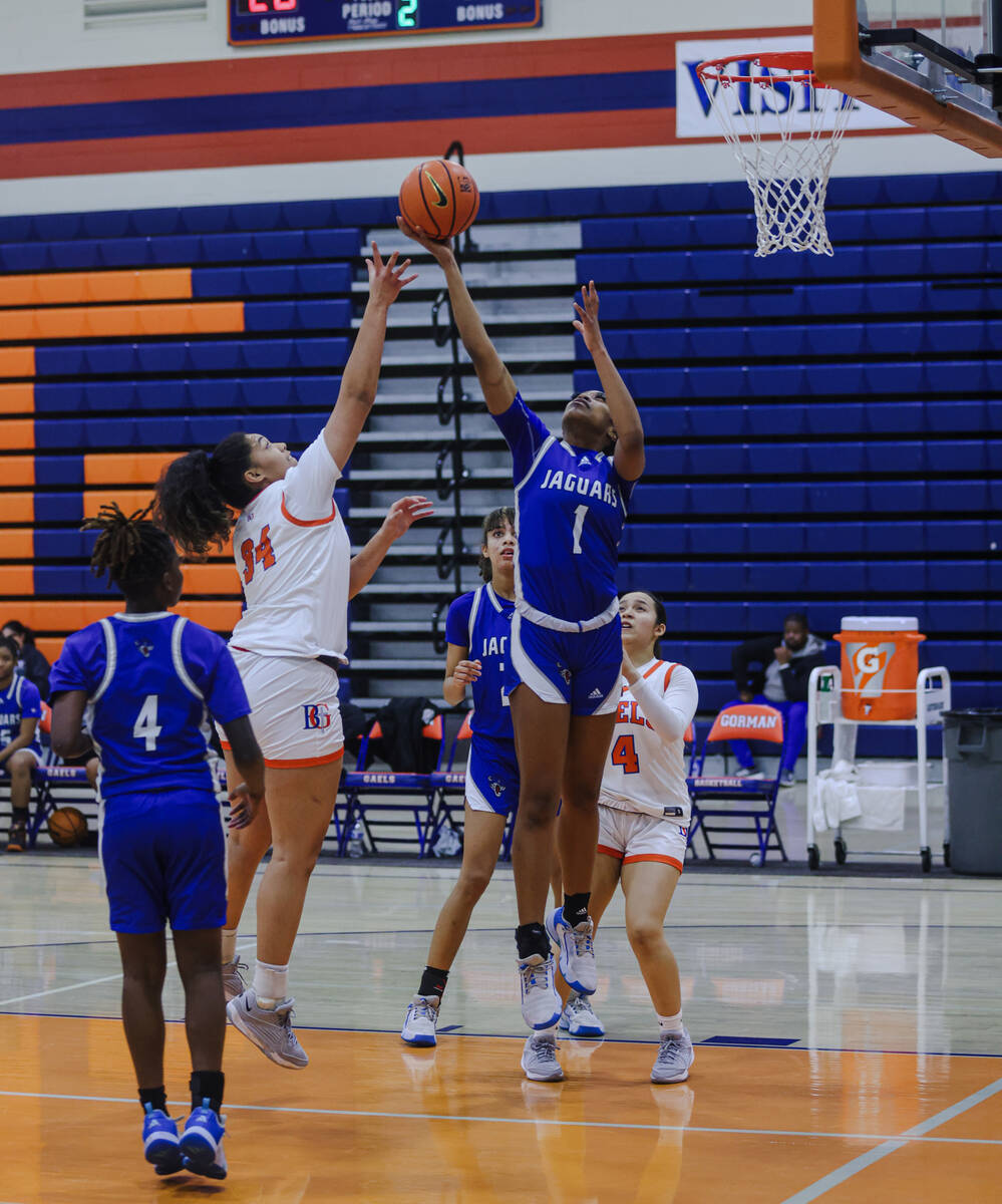 Desert Pines’ Siara Bracey (1) tries to block Bishop Gorman’s Aliitasi Fakatoumaf ...