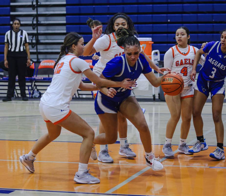 Desert Pines’ London Scott (10) tries to break past Bishop Gorman’s Addysen Carr ...