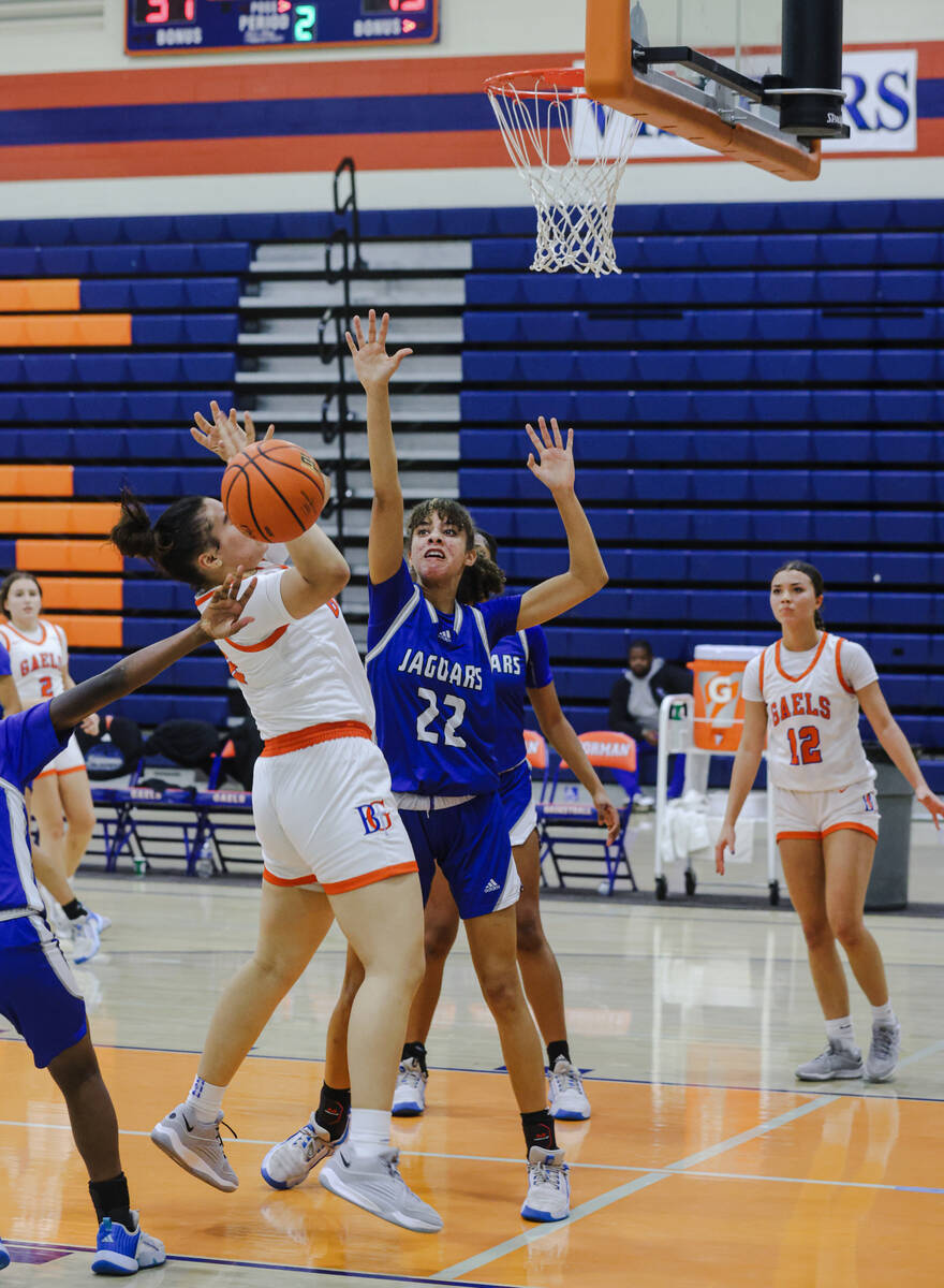 Desert Pines’ Trista Mabry (22) attempts to block Bishop Gorman’s Savannah Searcy ...