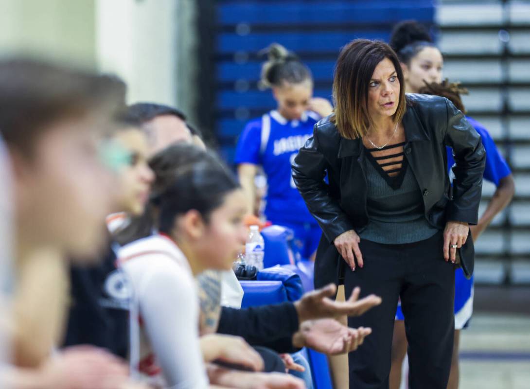 Bishop Gorman head coach Sheryl Krmpotich speaks with her staff during a game against Desert Pi ...