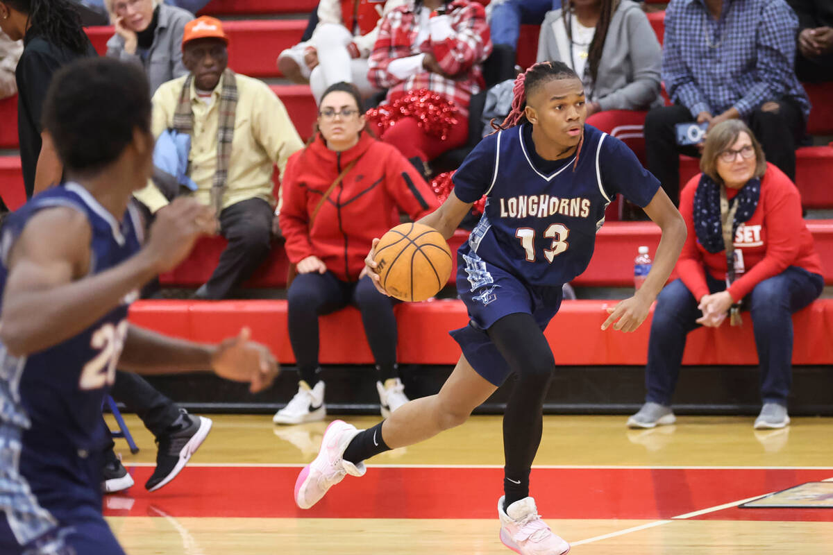 Legacy's Rahjon Chambers (13) brings the ball up court during the second half a basketball game ...