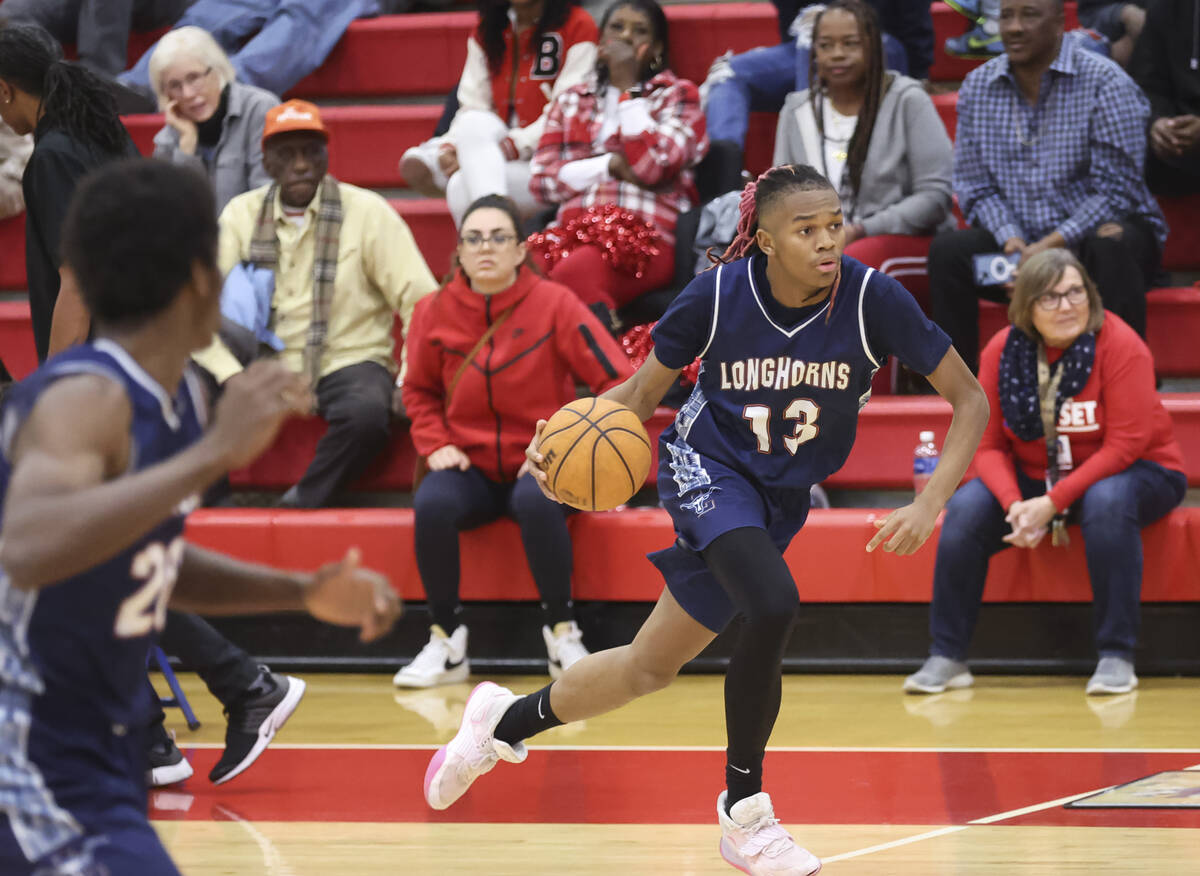 Legacy's Rahjon Chambers (13) brings the ball up court during the second half a basketball game ...